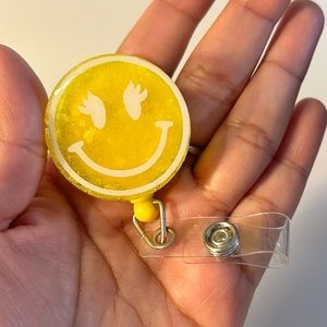Yellow Smiley Face Badge Reel